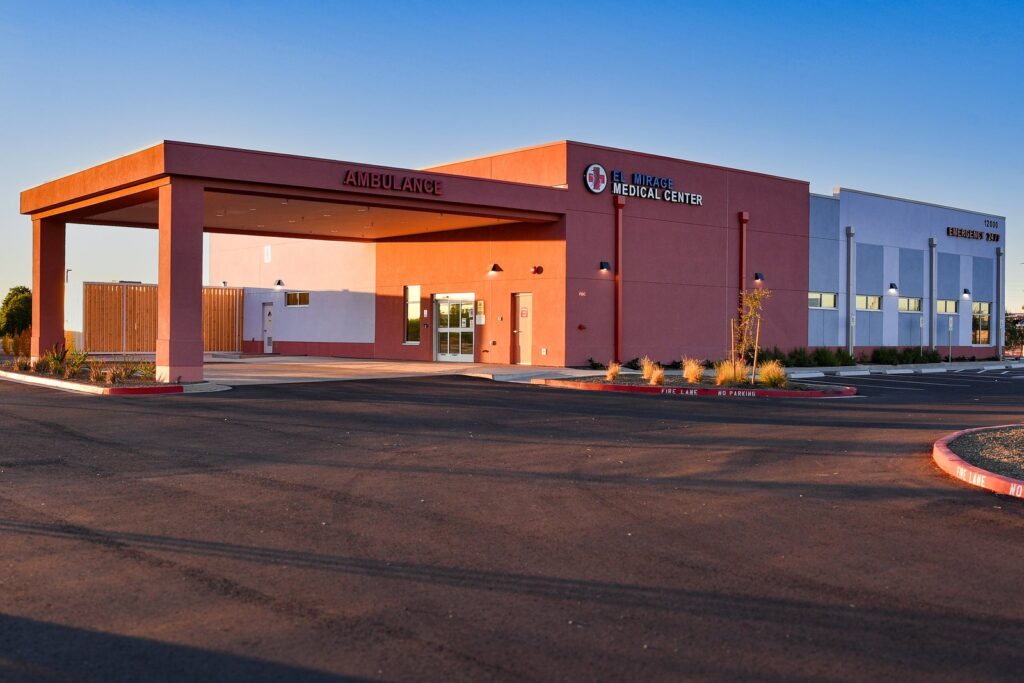 El Mirage Medical Center at sunset — the ambulance bay, with the EL MIRAGE MEDICAL CENTER and EMERGENCY 24/7 signage